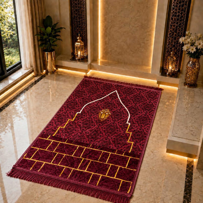 A rectangular red and black patterned prayer rug with gold geometric details and a white arch motif, displayed on a polished marble floor in a luxurious interior setting.