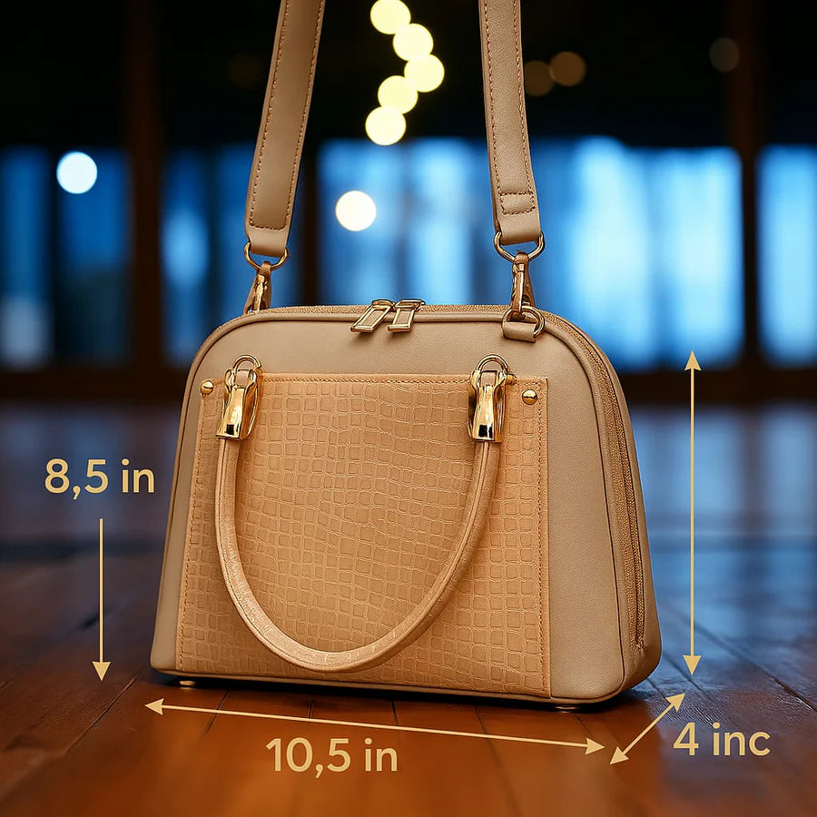 Close-up of Aura Luxe handbag showing the bubble zip closure and high-quality patent leather texture.