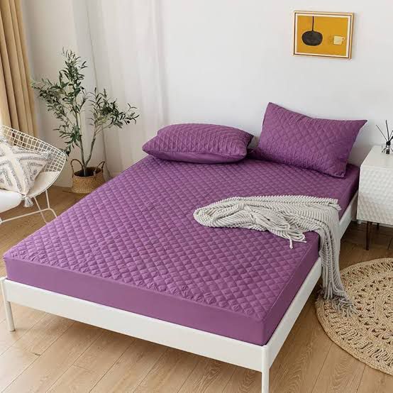 Deep Purple Quilted Waterproof Mattress Fitted Bed Sheet on contemporary beige bed with natural light from window.