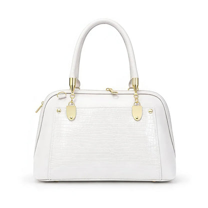 Interior view of Aura Luxe Patent Box Bag featuring dual compartments and zippered partition for organized storage...