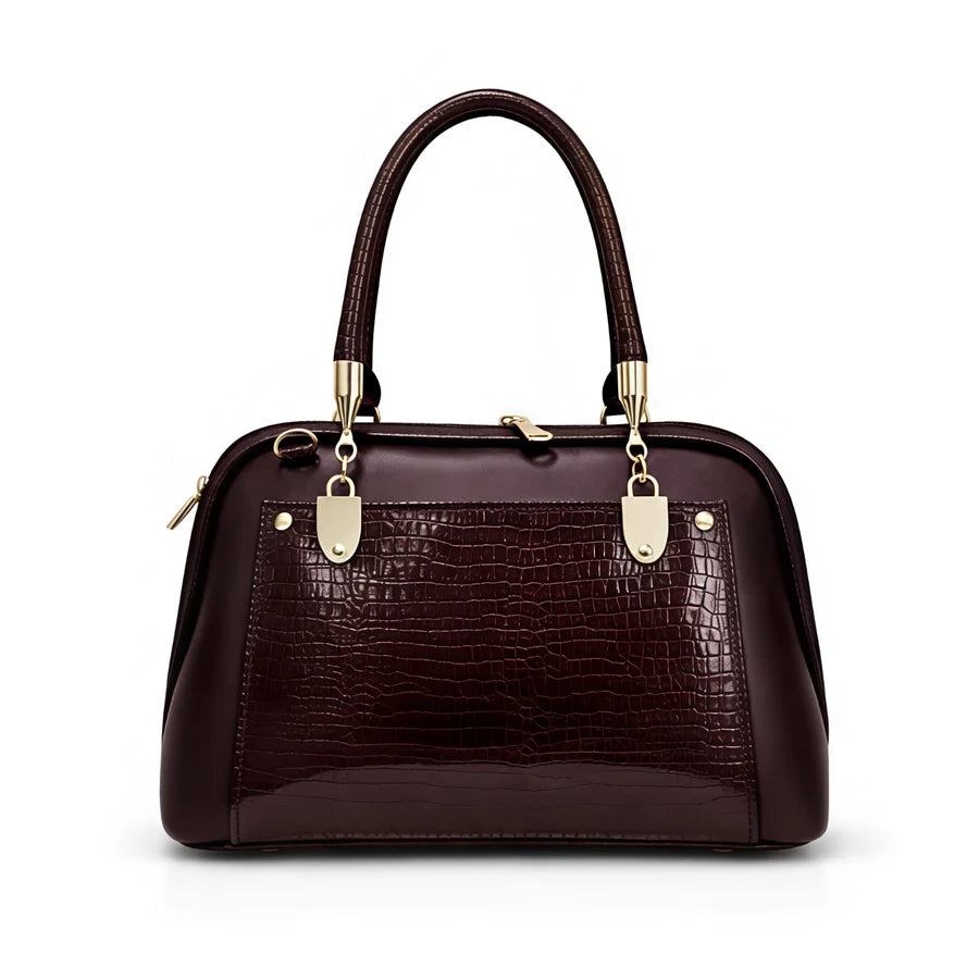 Side profile of the Aura Luxe Patent Box Bag showing the structured box design and scratch-resistant 