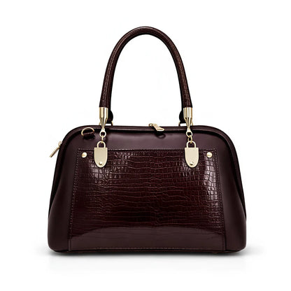 Side profile of the Aura Luxe Patent Box Bag showing the structured box design and scratch-resistant 