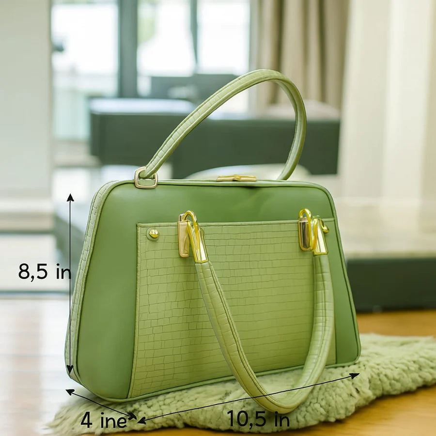 Side profile of the Aura Luxe Patent Box Bag showing the structured box design and scratch-resistant finish...