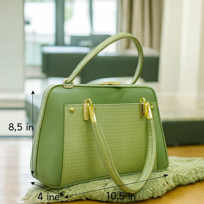 Side profile of the Aura Luxe Patent Box Bag showing the structured box design and scratch-resistant finish...