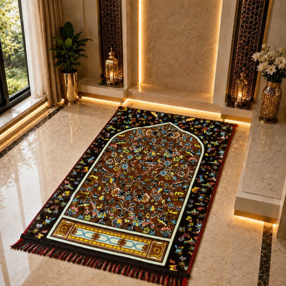 An ornate rectangular prayer rug with a detailed arch-shaped central motif and multicolored floral patterns, placed on a polished marble floor in a luxurious interior setting.