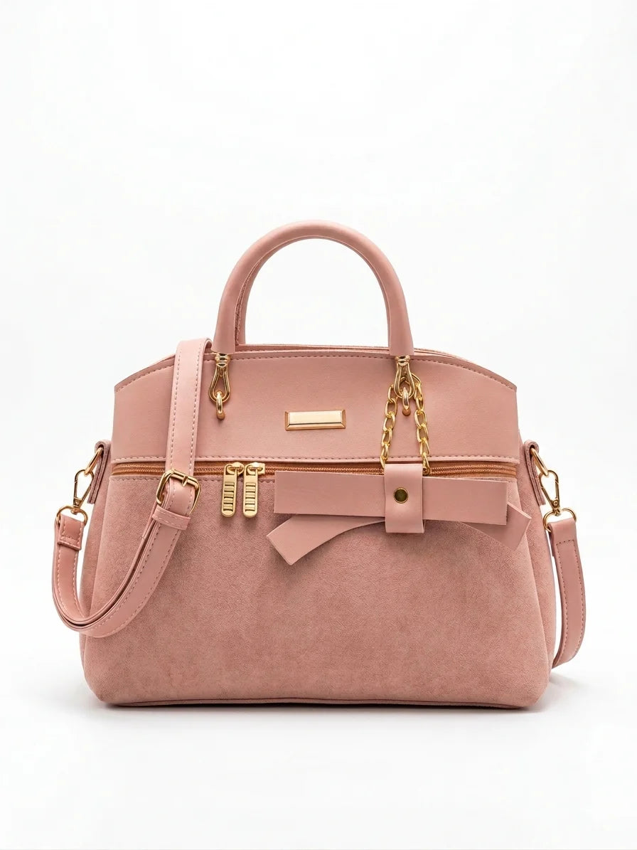 Wonder Mart Elara Bow Luxe Handbag featuring premium soft leather finish, elegant bow design, three spacious compartments, gold hardware, and adjustable shoulder strap......
