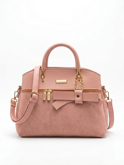 Wonder Mart Elara Bow Luxe Handbag featuring premium soft leather finish, elegant bow design, three spacious compartments, gold hardware, and adjustable shoulder strap......