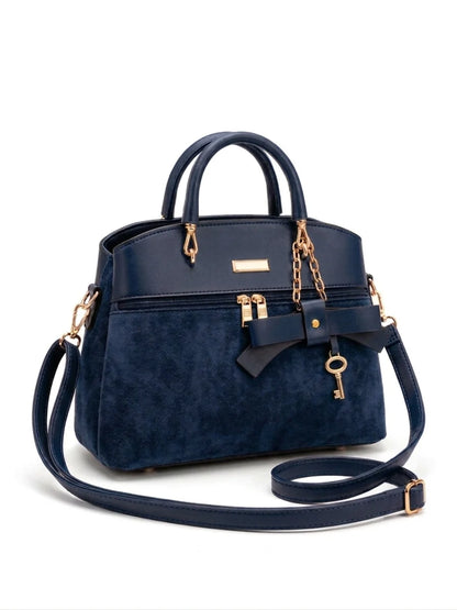Wonder Mart Elara Bow Luxe Handbag featuring premium soft leather finish, elegant bow design, three spacious compartments, gold hardware, and adjustable shoulder strap.....
