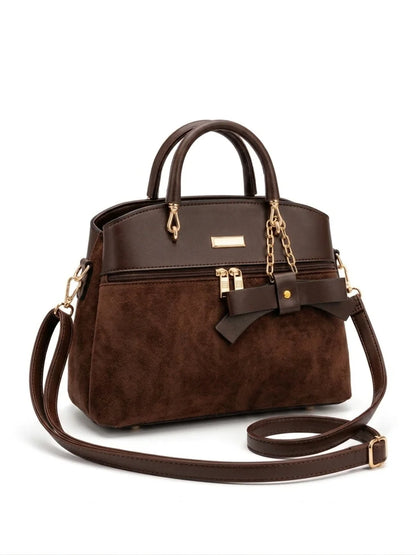 Wonder Mart Elara Bow Luxe Handbag featuring premium soft leather finish, elegant bow design, three spacious compartments, gold hardware, and adjustable shoulder strap....