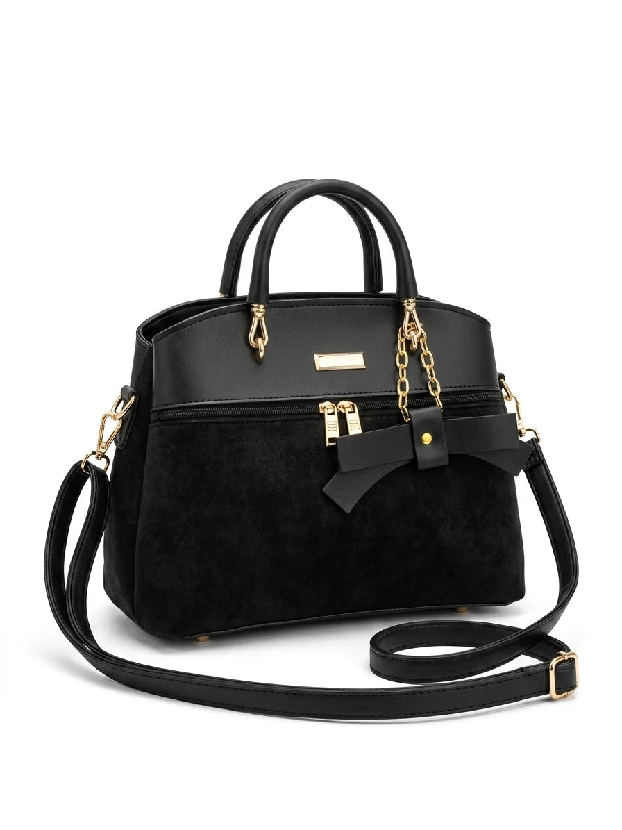 Wonder Mart Elara Bow Luxe Handbag featuring premium soft leather finish, elegant bow design, three spacious compartments, gold hardware, and adjustable shoulder strap...