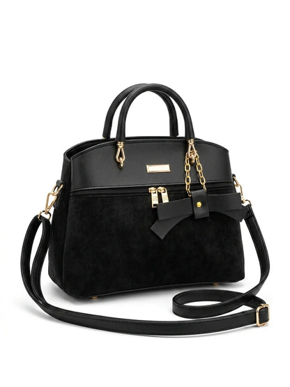 Wonder Mart Elara Bow Luxe Handbag featuring premium soft leather finish, elegant bow design, three spacious compartments, gold hardware, and adjustable shoulder strap...