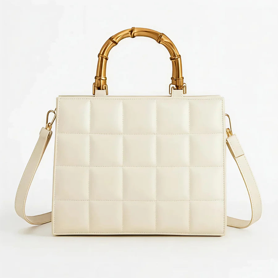 Wonder Mart Milano Bamboo Luxe Quilted Handbag in Black featuring premium leather, quilted design, bamboo-style top handles, gold-tone hardware, spacious interior, and adjustable shoulder strap....