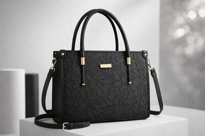 Wonder Mart Vienna Royale Embossed Tote Handbag in Royal black featuring premium faux leather, elegant embossed floral texture, gold-tone hardware, structured design, top handles, and detachable shoulder strap.