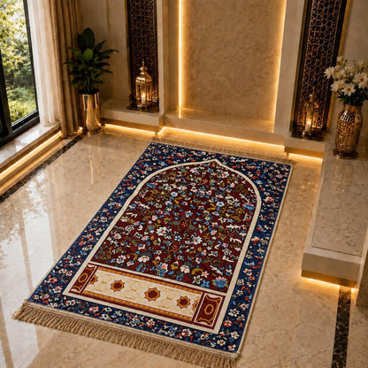 An ornate rectangular prayer rug with a floral arch design, displayed on a polished marble floor in a luxurious, warmly lit interior space.